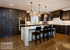 dark cherry l shape kitchen with white beaded island