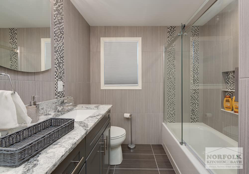 bathroom with quartz top and tiled walls and floor