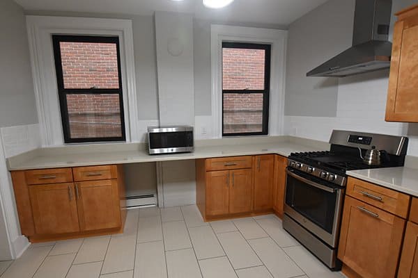 kitchen remodel with new cabinets, countertops and appliances at the Pine Street Inn Yearwood House in Boston, MA