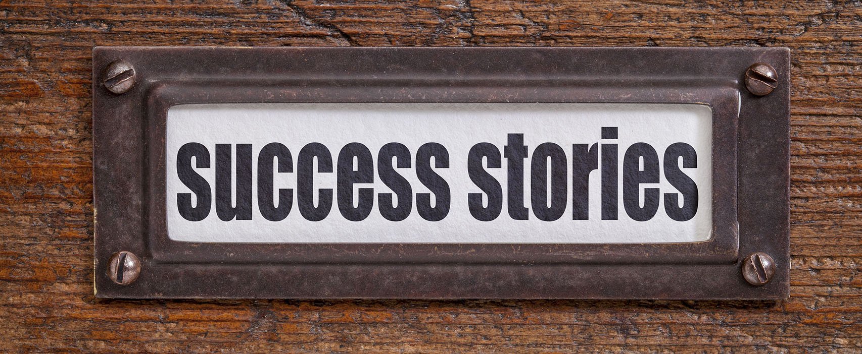 plaque that reads "success stories"