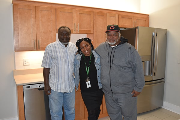 Pine Street Inn - Yearwood House tenants with their property manager in Boston, MA