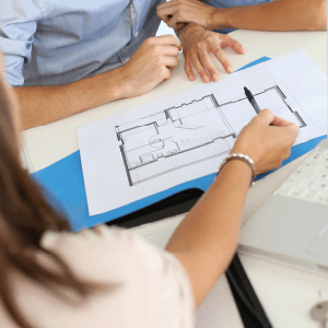 close up of designer pointing out design to customer